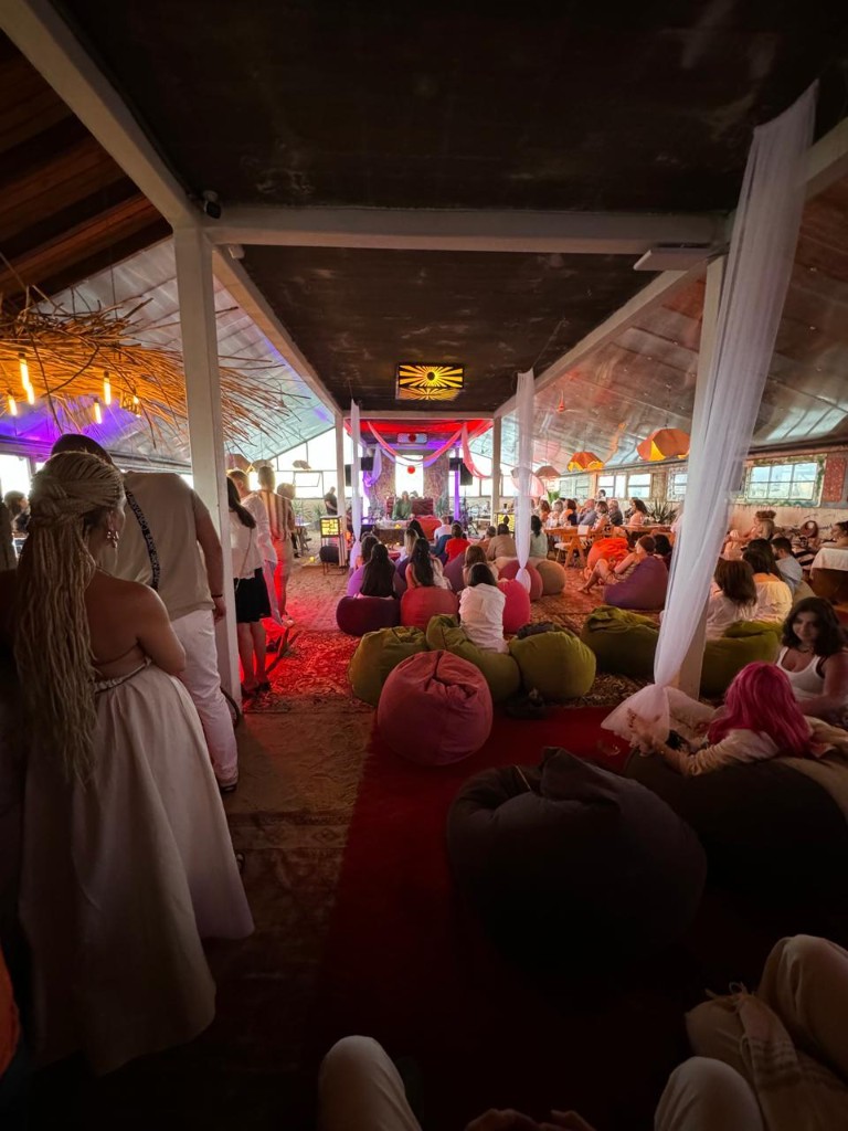 1001 Nights immersive performance with audience seated on rugs in a caravanserai-inspired space